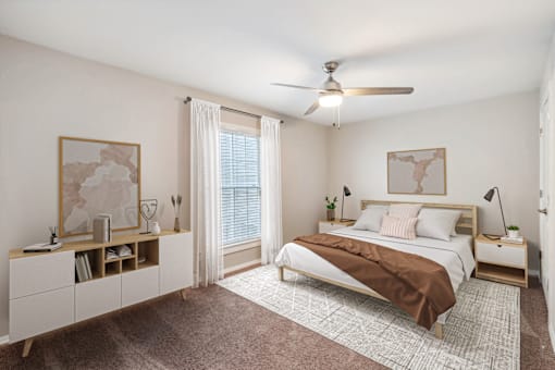a bedroom with a bed and a ceiling fan at Lake Johnson Mews, North Carolina, 27606