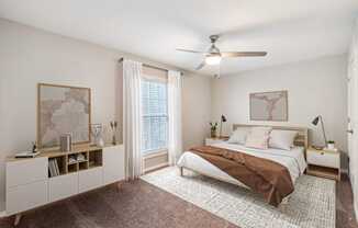 a bedroom with a bed and a ceiling fan at Lake Johnson Mews, North Carolina, 27606