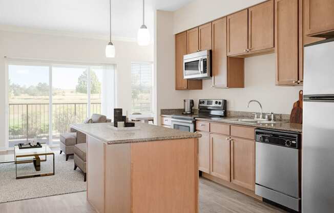 a kitchen with wooden cabinets and stainless steel appliances