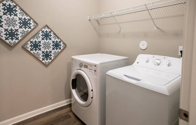 a washer and dryer in a laundry room at Meridian Park in Collierville, TN 38017