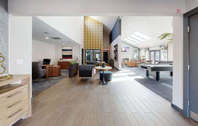 A spacious office lobby with a reception desk and seating area.