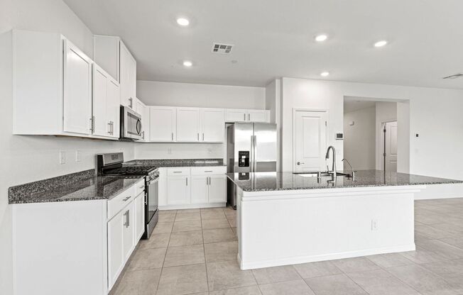 Newly Built 6 Bed / 2.5 Bath Single-Family Home with Upgraded Kitchen and Fully Fenced Yard in Southwest Las Vegas near I-15