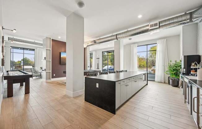 a kitchen with a large island in the middle of a room at The Quarry Luxury Apartment Homes, Fort Collins, Colorado