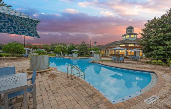 a swimming pool with a building in the background