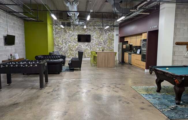 a game room with a pool table and a tv