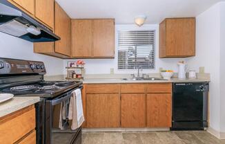 a kitchen with a stove oven and refrigerator