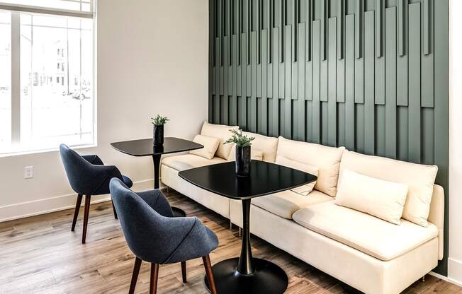 Clubhouse seating area with booths at Hanover Flats in Bennington, NE