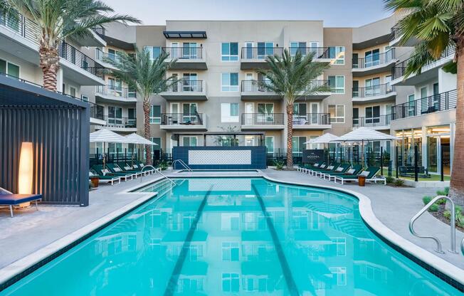 Enjoy a resort-style pool with a peaceful lounge area at Modera Pomona.