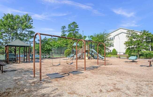 A playground with swings and a slide.