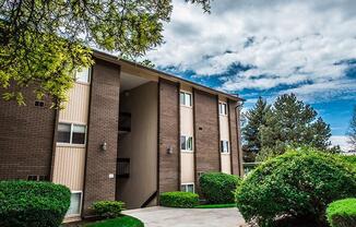 A building with a brown facade and a large entrance.