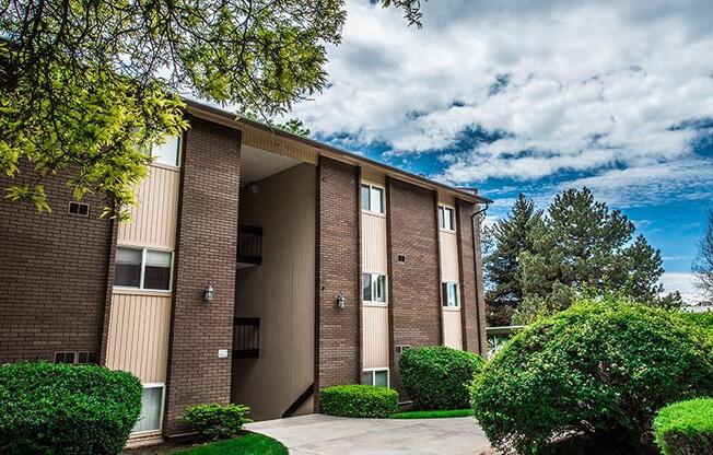 A building with a brown facade and a large entrance.