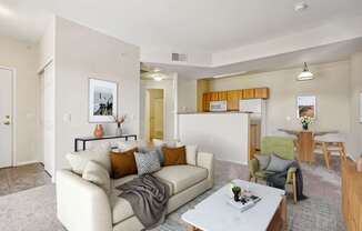 A living room with a white couch and a coffee table.