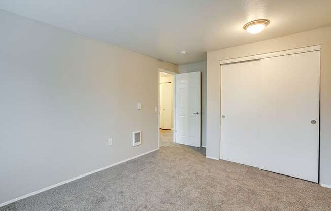 Bedroom with carpet and closet