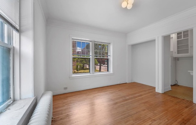 a living room with a couch and a window