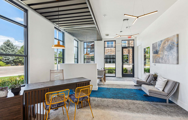 a living room with white walls and a large window