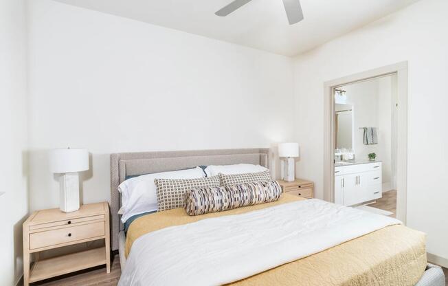 Granite countertops and sleek finishes create a refined bathroom retreat at Beckett West Fork in Conroe.