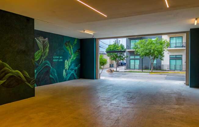 a large open space with a large mural on the wall