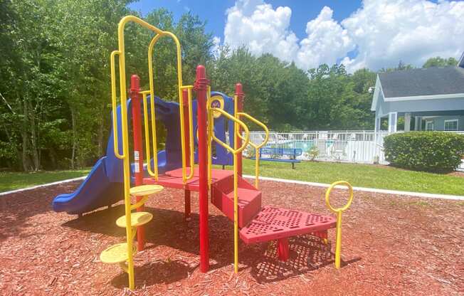 Outdoor Playground equipped with a slide, monkey bars, and latter