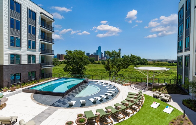 Dive into fun at Modera Trinity's resort-style pool and enjoy a game of Cornhole! Where leisure meets play, right by the poolside.