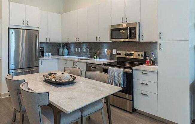 Stylish white cabinetry with stainless appliance package at 2000 West Creek Apartments, Virginia, 23238