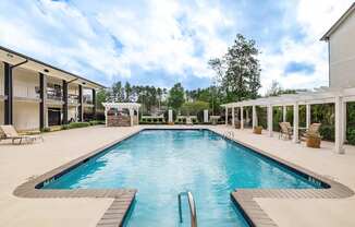 A large rectangular pool with a diving board in the middle.