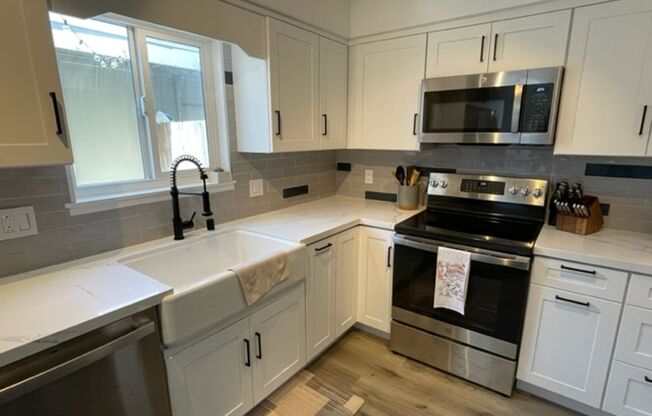 Rent Special - 2 weeks free rent!!! remodeled 4 bedroom, 2 story townhome in the heart of Huntington Beach.