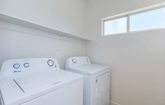 a laundry room with a washer and dryer