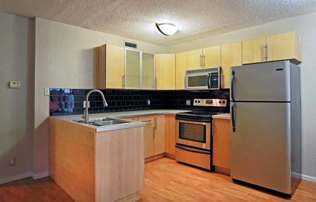 kitchen with brown cabinets and silver appliances