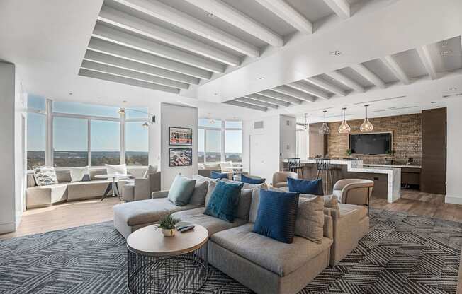A living room with a grey couch and a coffee table.