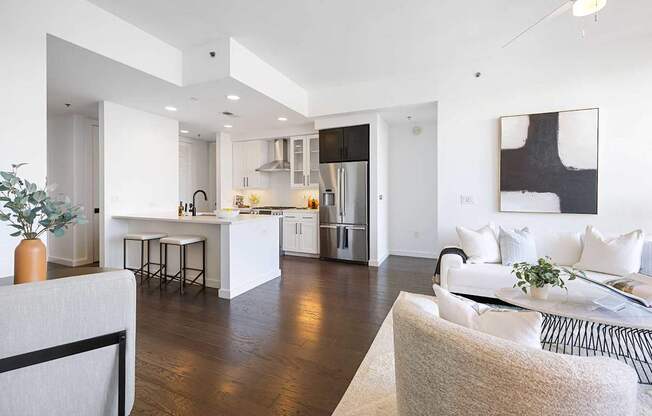 A modern kitchen with white cabinets and a large island.