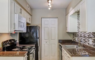 kitchen with appliances in apartment