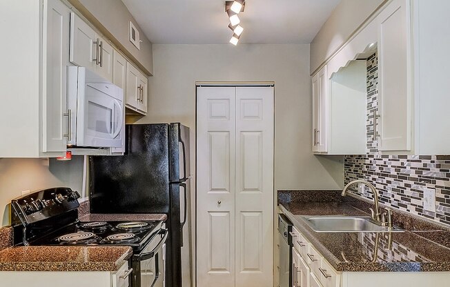 kitchen with appliances in apartment