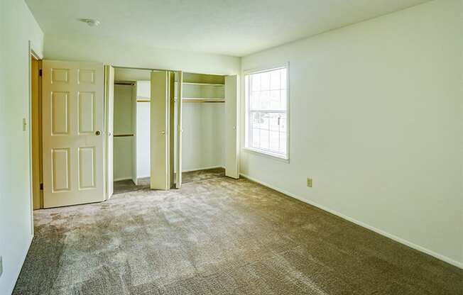 Townhome Master Bedroom with Window and Closets at Williamsburg on the Lake Valparaiso