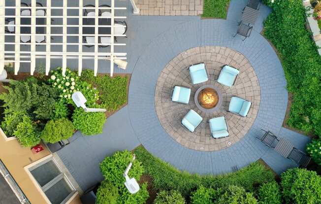 a courtyard with chairs and a fire pit at 15 Bank Apartments, White Plains, NY, New York