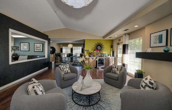 Rocklin manor Leasing office seating/lounge area with four cushioned swivel chairs 