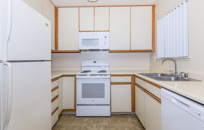 a kitchen with a sink and a microwave