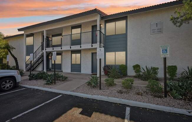 A building with a parking sign in front of it.