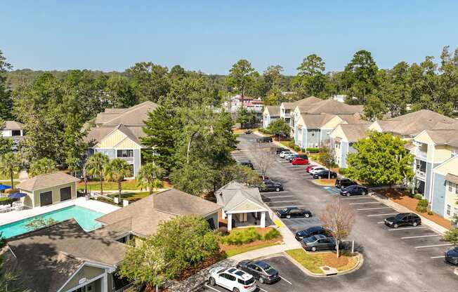 A view of a residential area with houses and cars.