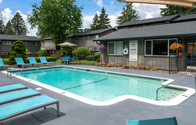 a swimming pool in front of a house
