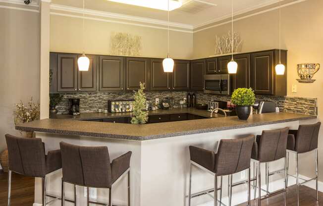 a kitchen with a large island with a breakfast bar