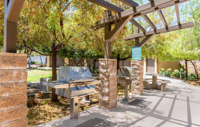 A picnic area with a grill and a shelter.