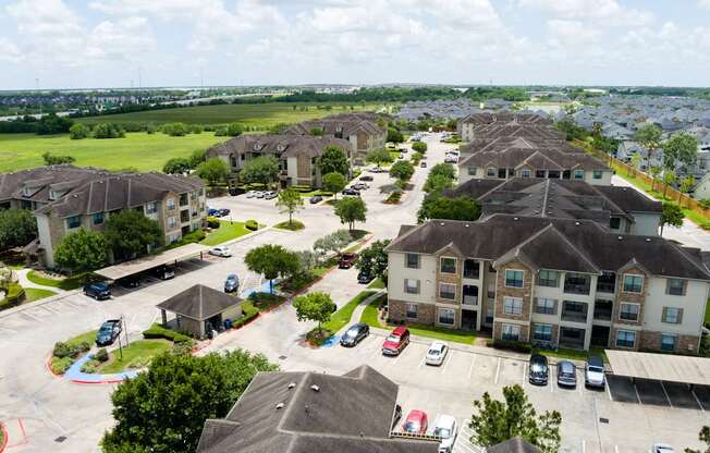 A view of a residential area with houses and cars.