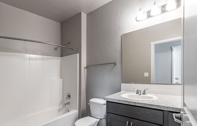 a bathroom with a toilet sink and bathtub