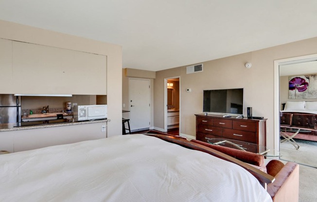 Sleeping area with carpet floorings in a studio units in Marina tower apartment rentals near santa monica