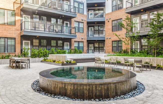 Tranquil Water Fountain Feature for Serene Ambiance at St. Elmo Apartment in Austin, TX