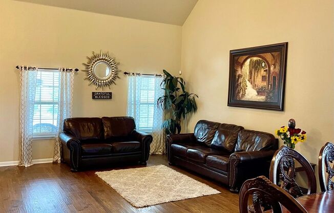 Elegant four‑bedroom corner‑lot home with hardwood floors, modern kitchen, master suite, and community amenities near Hwy I‑20.