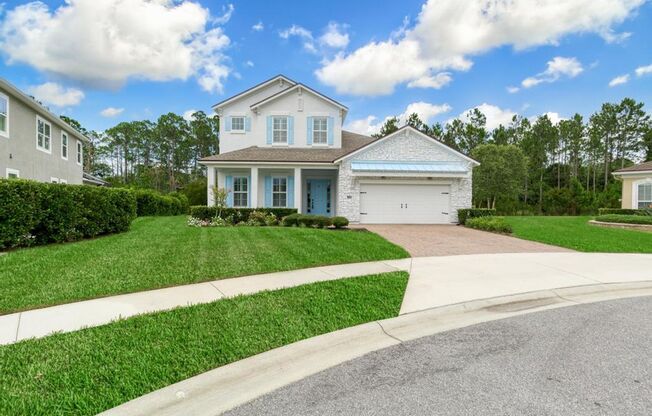 Welcome Home to this beautifully designed home located in the prestigious gated community of Coastal Oaks in Ponte Vedra