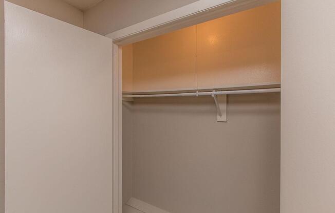 open closet with a shelf