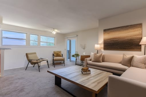 a living room with couches and a coffee table