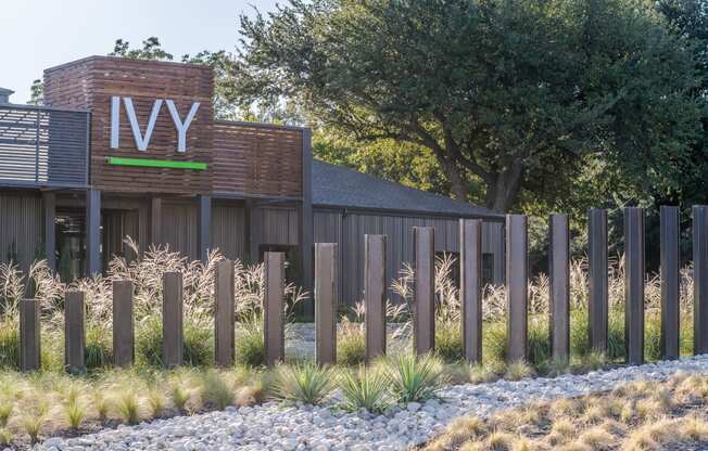 a view of the front of the building with a fence in front of it